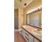 Bathroom with double sinks, a shower, and a bathtub at 608 Sweet Bay Cir, Winter Haven, FL 33884