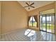 Spacious bedroom with lake view and tile floors at 608 Sweet Bay Cir, Winter Haven, FL 33884