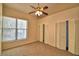 Well-lit bedroom featuring a large window and closet at 608 Sweet Bay Cir, Winter Haven, FL 33884