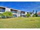 Exterior view of condo building with landscaping at 608 Sweet Bay Cir, Winter Haven, FL 33884