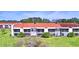 Exterior view of condo building with red tile roofs at 608 Sweet Bay Cir, Winter Haven, FL 33884