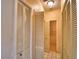 Hallway with built-in storage and access to laundry and bathroom at 608 Sweet Bay Cir, Winter Haven, FL 33884
