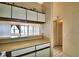 Kitchen with pass-through to living area and ample cabinetry at 608 Sweet Bay Cir, Winter Haven, FL 33884