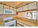 Kitchen features a pass-through to dining area at 608 Sweet Bay Cir, Winter Haven, FL 33884