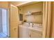 Stackable washer and dryer in a small laundry closet at 608 Sweet Bay Cir, Winter Haven, FL 33884