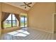 Bright living room with tile floors and lake view at 608 Sweet Bay Cir, Winter Haven, FL 33884