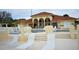 Community pool with steps and lounge chairs at 608 Sweet Bay Cir, Winter Haven, FL 33884