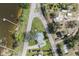 A view of a tranquil lake and neighborhood roads, properties, and docks seen from overhead at 922 S Lake Reedy Blvd, Frostproof, FL 33843