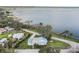 Breathtaking aerial view of a lakeside property with a private dock, lush landscaping, and scenic surroundings at 922 S Lake Reedy Blvd, Frostproof, FL 33843
