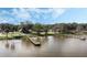An aerial view showcases a serene lake with multiple wooden docks extending into the water at 922 S Lake Reedy Blvd, Frostproof, FL 33843