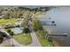 Aerial view showcasing a lake community with multiple docks, trees, and blue roofs at 922 S Lake Reedy Blvd, Frostproof, FL 33843