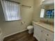 Bathroom featuring tile flooring, a modern vanity, and a window at 922 S Lake Reedy Blvd, Frostproof, FL 33843