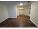 Cozy bedroom with wood floors, closet, and full-length mirror offers ample storage at 922 S Lake Reedy Blvd, Frostproof, FL 33843