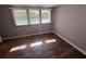 Bright bedroom featuring wood-look flooring and a window with natural light at 922 S Lake Reedy Blvd, Frostproof, FL 33843