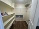Spacious walk-in closet with built-in shelves at 922 S Lake Reedy Blvd, Frostproof, FL 33843