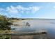 Aerial view featuring docks with natural wood extending into the calm lake under a blue sky at 922 S Lake Reedy Blvd, Frostproof, FL 33843
