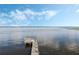 Scenic view of the private wooden dock on the tranquil lake, perfect for relaxation and enjoying water activities at 922 S Lake Reedy Blvd, Frostproof, FL 33843