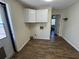 Bright laundry room with upper cabinets and modern flooring at 922 S Lake Reedy Blvd, Frostproof, FL 33843
