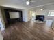 Living room features an entertainment center, piano, and two ceiling fans at 922 S Lake Reedy Blvd, Frostproof, FL 33843