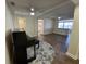 Bright living room with hardwood floors and a piano at 922 S Lake Reedy Blvd, Frostproof, FL 33843