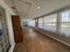 Spacious sunroom with wood floors, bright light, and multiple windows at 922 S Lake Reedy Blvd, Frostproof, FL 33843