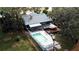 Aerial view shows home with pool, deck, and private dock access at 952 N Heron Cir, Winter Haven, FL 33884