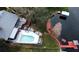 Aerial view of house, pool, dock, and lakefront property at 952 N Heron Cir, Winter Haven, FL 33884