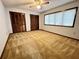 Spacious bedroom with double closets and carpeted floors at 952 N Heron Cir, Winter Haven, FL 33884