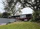 House exterior with lake view and large backyard at 952 N Heron Cir, Winter Haven, FL 33884