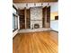 Brick fireplace is a focal point in the living room at 952 N Heron Cir, Winter Haven, FL 33884