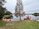 Expansive lakefront view with dock and trees at 952 N Heron Cir, Winter Haven, FL 33884
