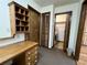 Laundry room with washer, dryer, and built-in shelving at 952 N Heron Cir, Winter Haven, FL 33884