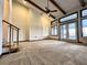 Spacious living room with high ceilings, exposed beams, and large windows at 952 N Heron Cir, Winter Haven, FL 33884