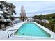 Inviting swimming pool with lake view at 952 N Heron Cir, Winter Haven, FL 33884