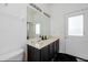 Bathroom with double vanity and access to backyard at 1005 Corvina Dr, Davenport, FL 33897