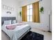 Cozy bedroom with queen-size bed and large windows at 1005 Corvina Dr, Davenport, FL 33897