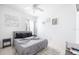 Guest bedroom with queen-size bed and window at 1005 Corvina Dr, Davenport, FL 33897