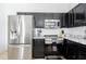 Modern kitchen with stainless steel appliances and marble counters at 1005 Corvina Dr, Davenport, FL 33897