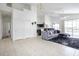 Spacious living room with grey sectional sofa and access to pool at 1005 Corvina Dr, Davenport, FL 33897