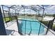 Inviting screened pool with safety fence at 1005 Corvina Dr, Davenport, FL 33897