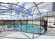 Refreshing screened pool with safety fence at 1005 Corvina Dr, Davenport, FL 33897