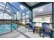 Relaxing pool area with patio furniture at 1005 Corvina Dr, Davenport, FL 33897