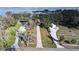 Sprawling estate features long driveway leading to main house with lake access and several outbuildings at 1006 W Lake Hamilton Dr, Winter Haven, FL 33881