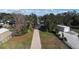 Aerial view of home on large lot with long driveway and lake access at 1006 W Lake Hamilton Dr, Winter Haven, FL 33881