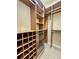 Walk-in closet featuring custom wood shelving and metal storage baskets at 1006 W Lake Hamilton Dr, Winter Haven, FL 33881