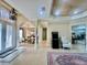 Elegant foyer showcases tile floors, columns, tray ceiling, dining room and game console at 1006 W Lake Hamilton Dr, Winter Haven, FL 33881