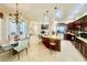 Open-concept kitchen with eat-in dining area, stainless steel appliances, and center island at 1006 W Lake Hamilton Dr, Winter Haven, FL 33881