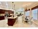Bright and airy kitchen with granite counters, stainless appliances, and an adjoining dining area at 1006 W Lake Hamilton Dr, Winter Haven, FL 33881