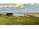 Picturesque lake view showcasing wooden dock and gazebo, perfect for relaxation at 1006 W Lake Hamilton Dr, Winter Haven, FL 33881