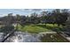 Picturesque lake view with private dock access and expansive green lawn at 1006 W Lake Hamilton Dr, Winter Haven, FL 33881